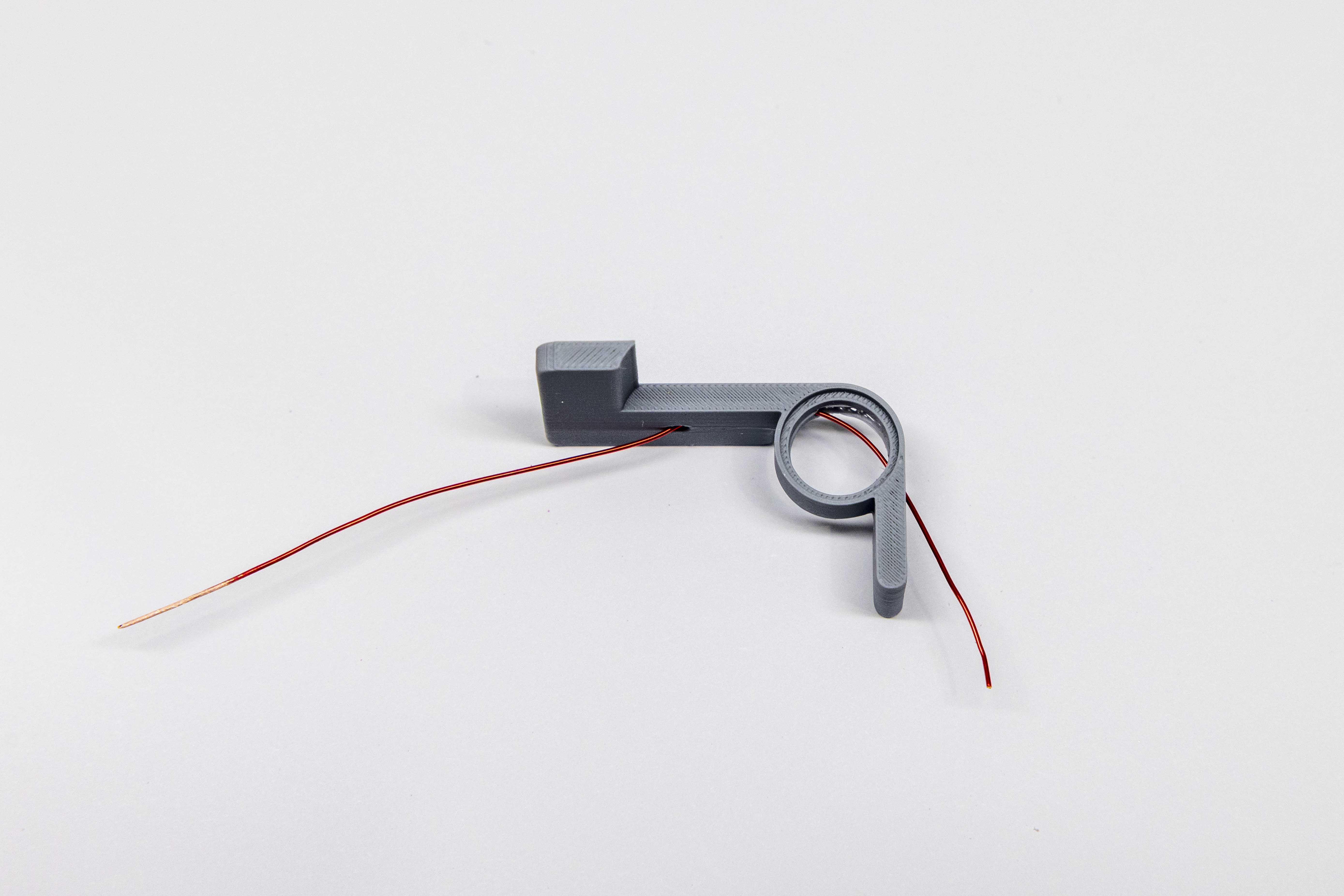 Wire threading complete on paddle arm