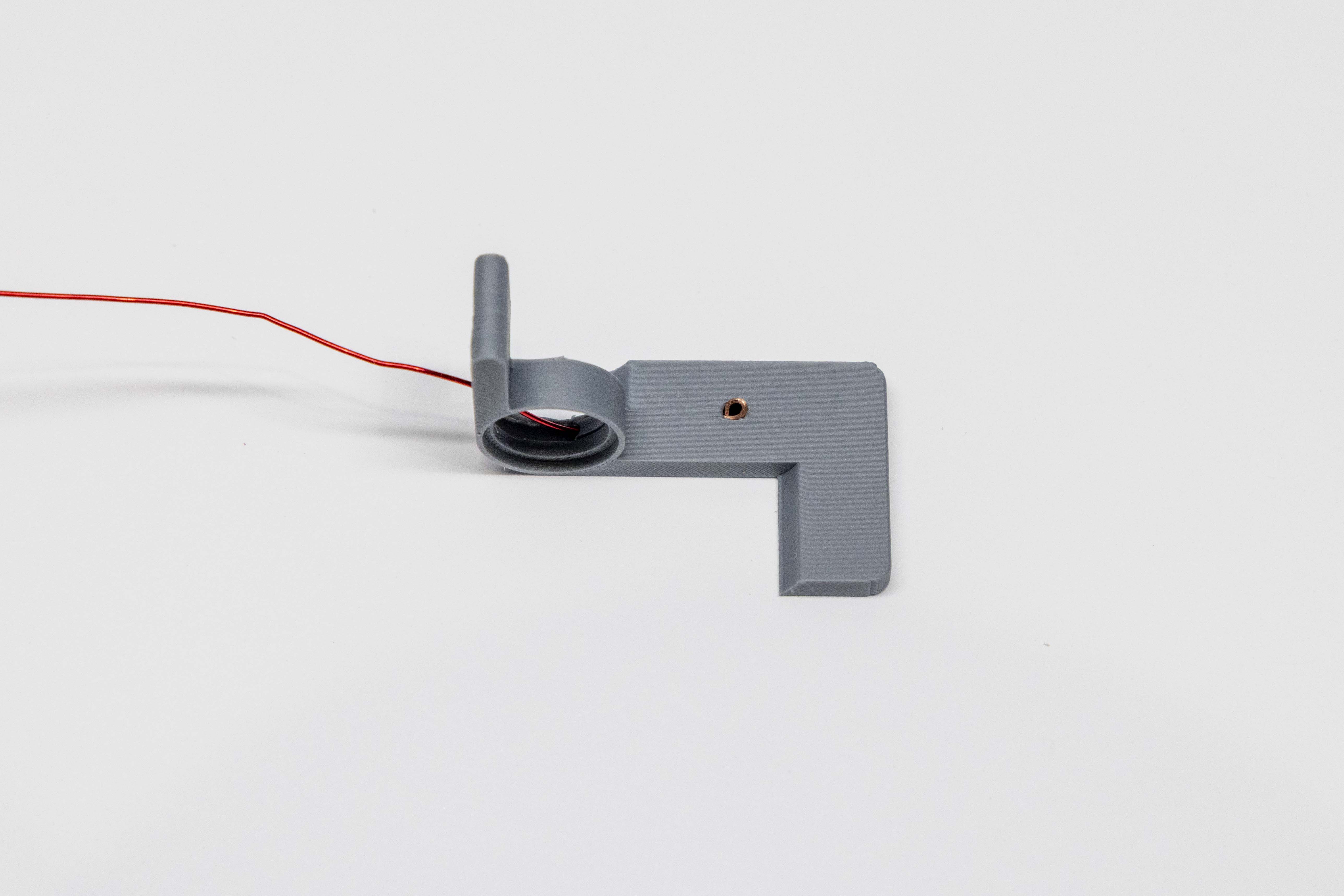 Loop seated against opening of wiring hole