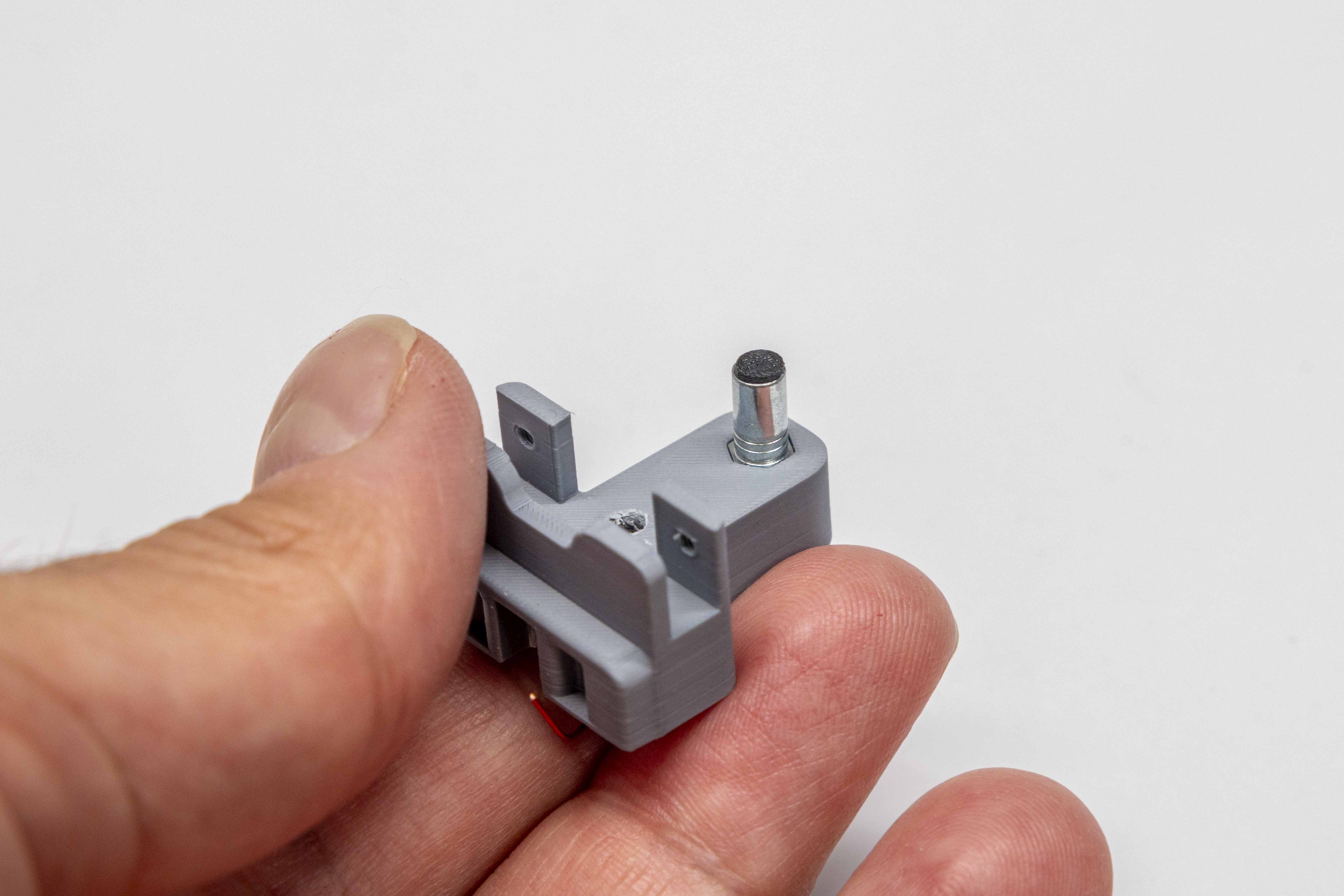 M3 screw being threaded from above