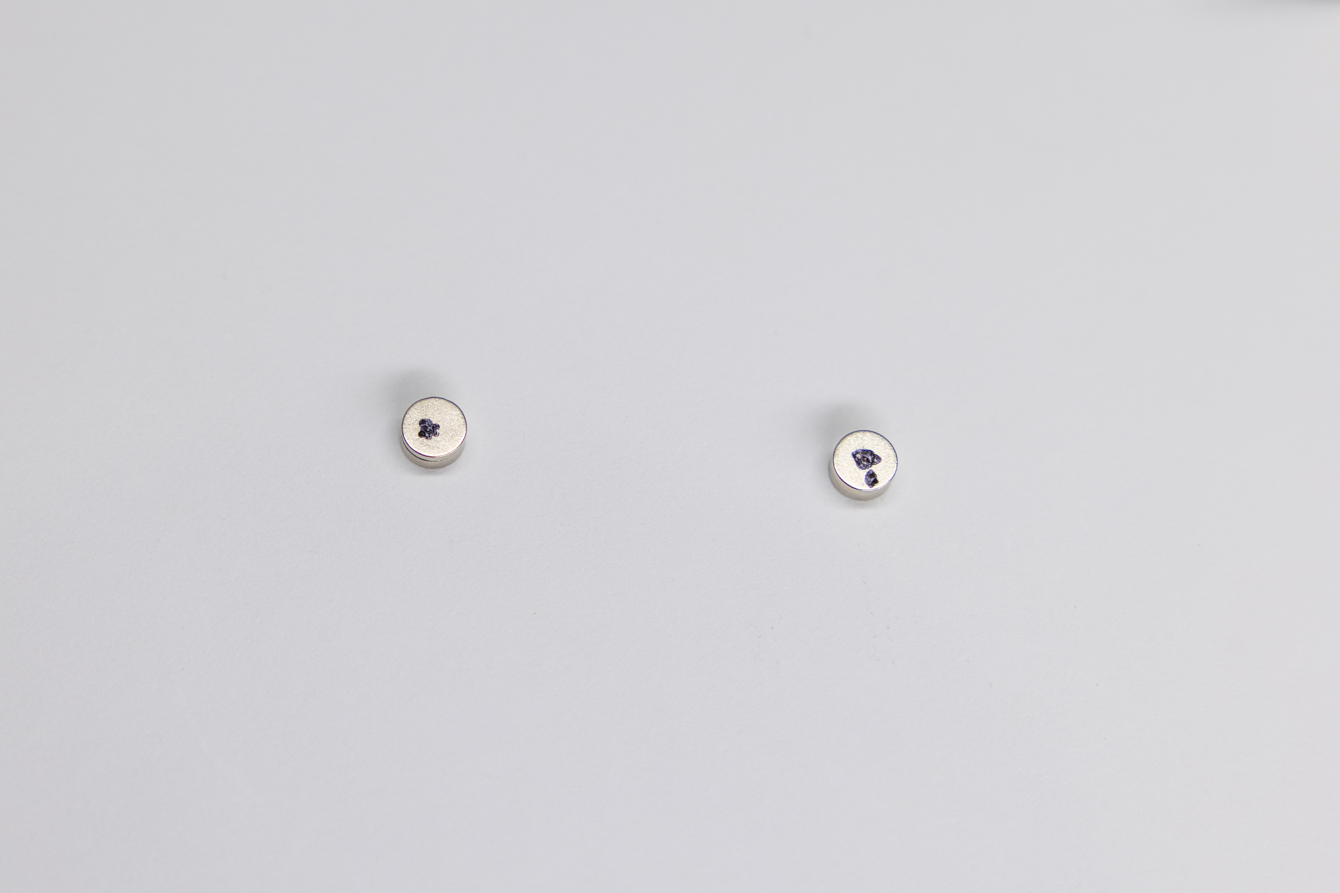 Magnet pair marked with sharpie dots on outward-facing sides